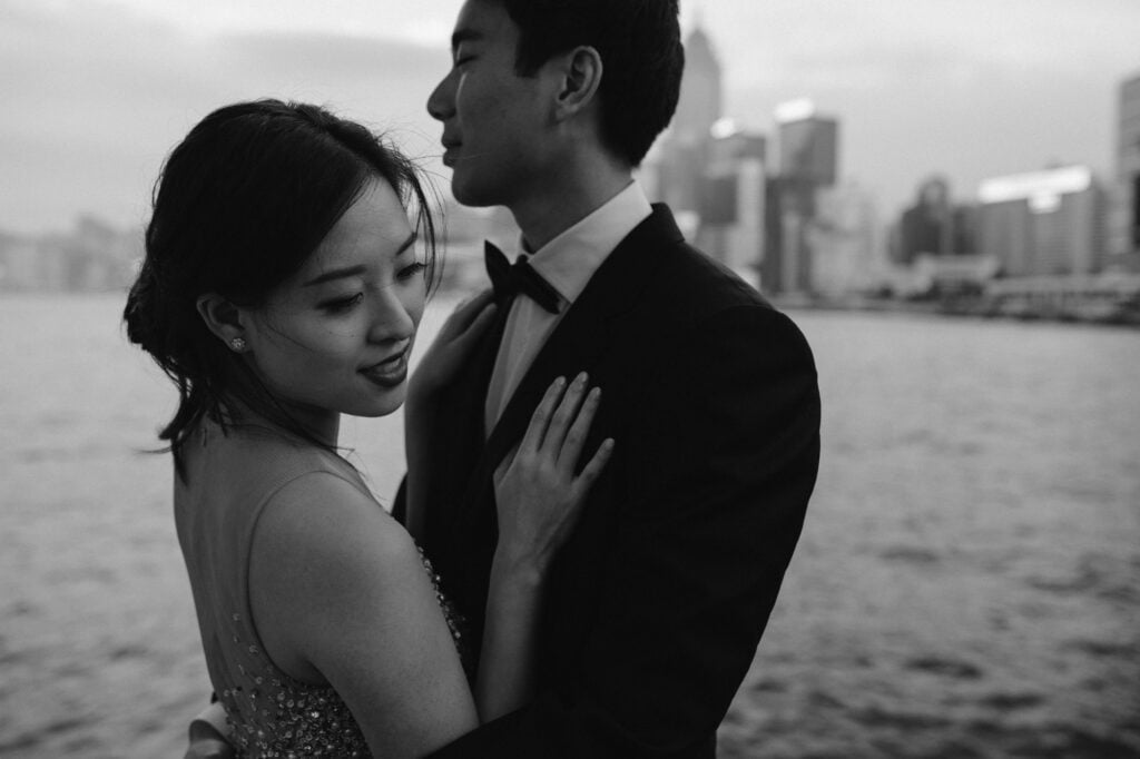Couple embracing on portrait shoot at Victoria Harbour, Hong Kong