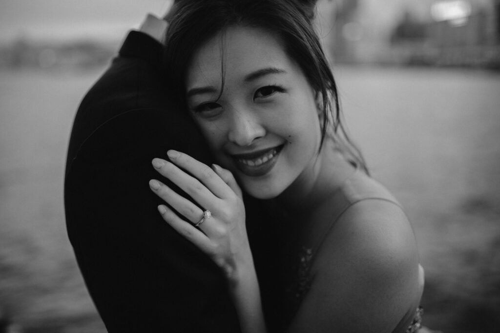 Couple embracing on portrait shoot at Victoria Harbour, Hong Kong