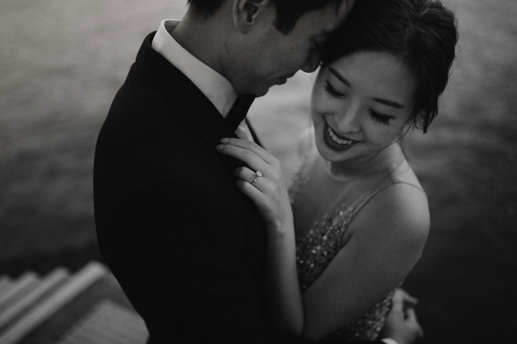 Couple embracing on portrait shoot at Victoria Harbour, Hong Kong