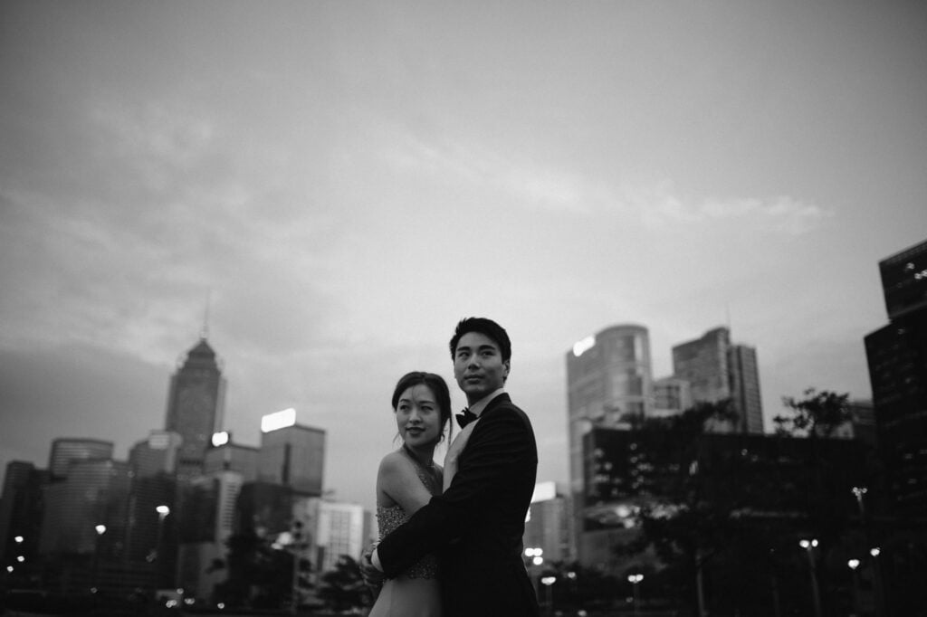 Portrait shoot of couple with backdrop of Hong Kong Skyline from Victoria Harbour at night