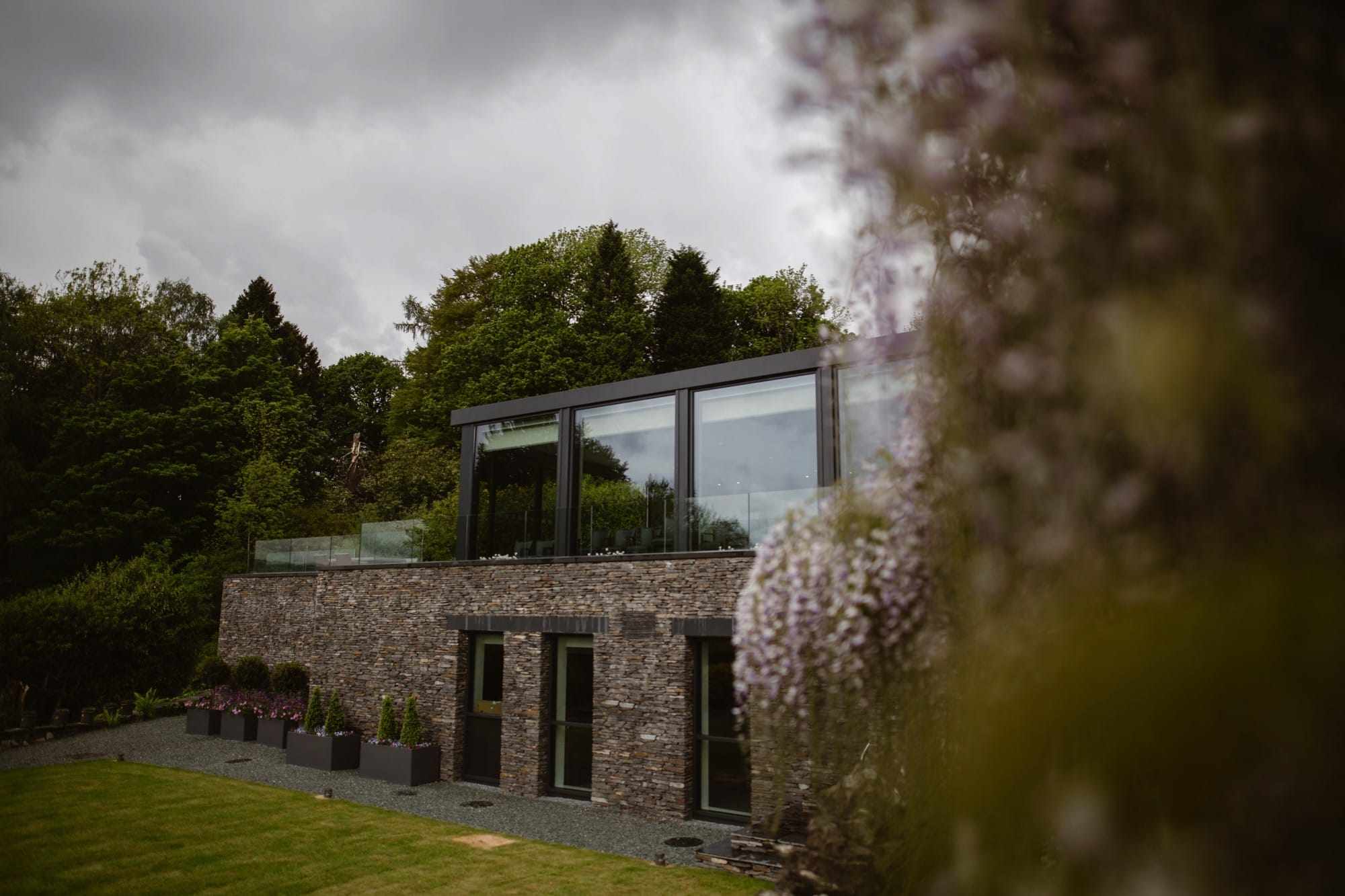 Exterior of The Samling Hotel's modern glass restaurant extension