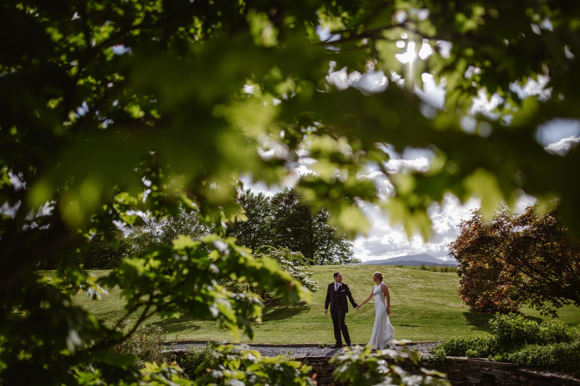 Bride & Groom walking in the grounds of The Samling Hotel
