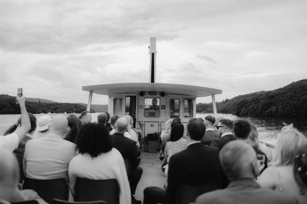 Wedding guests enjoying a boat ride on lake Windermere