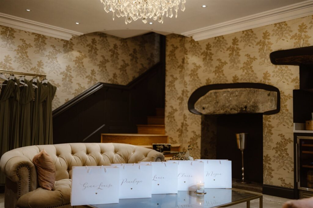 Elegant room with chandelier and gift bags.