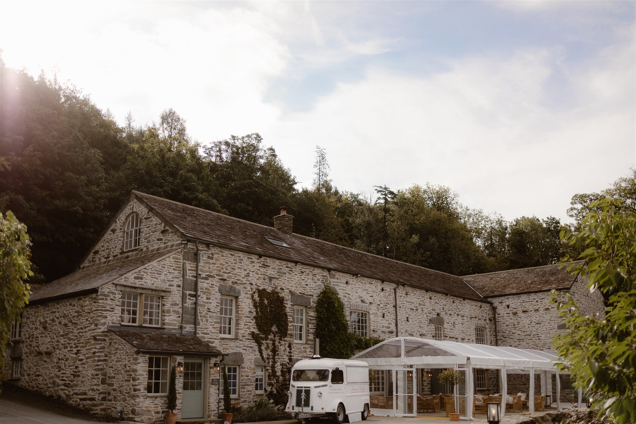 External shot of Town Head Estate showing a stone building with a marquee extension.