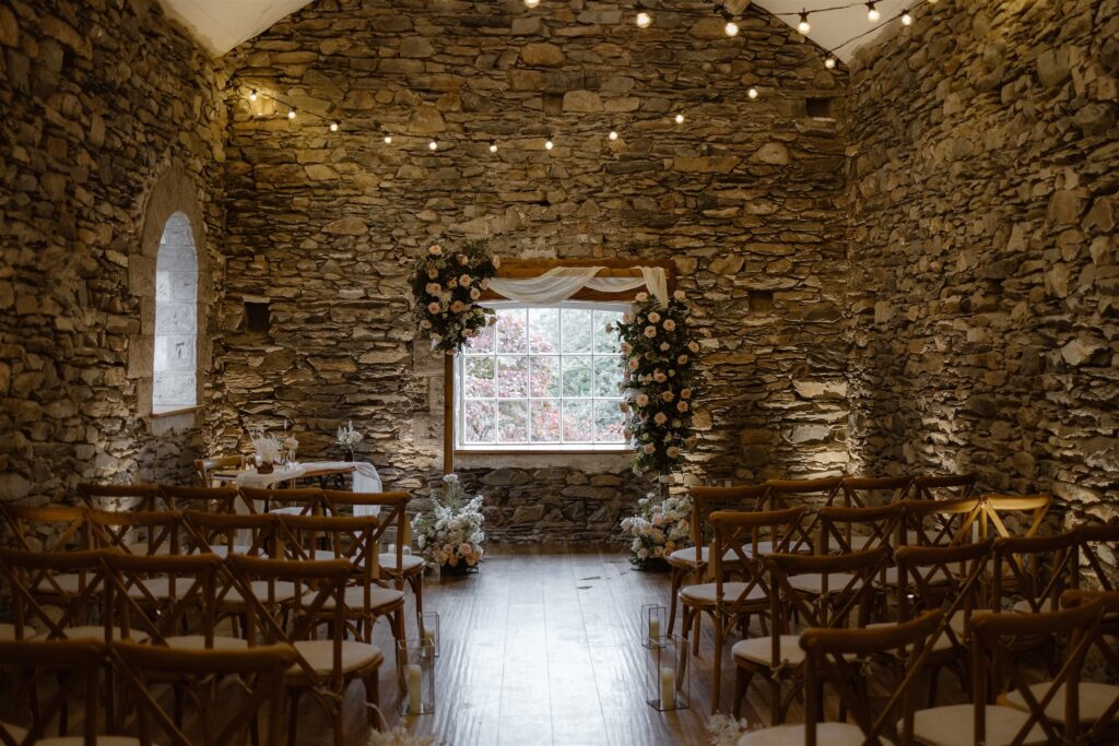 Indoor ceremony space at Town Head showing a rustic stone barn wedding ceremony setup.