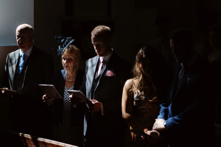 Wedding Guests singing during Church ceremony