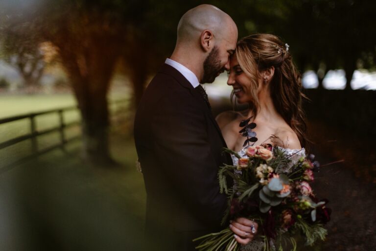 Bride & Groom resting heads together during portrait session