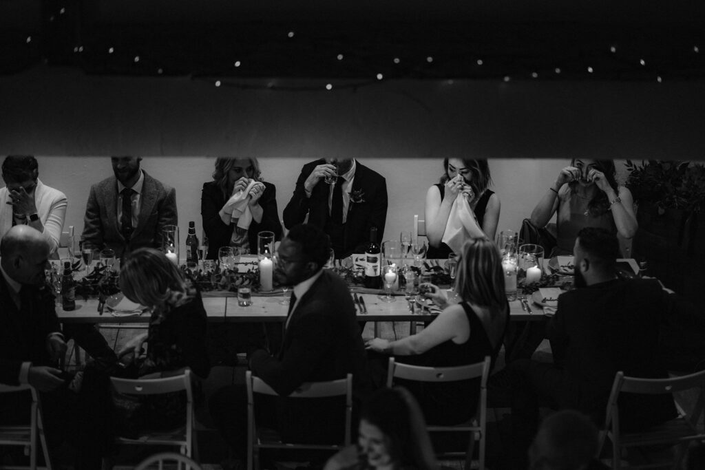 Table of guests crying during speeches at a micro wedding