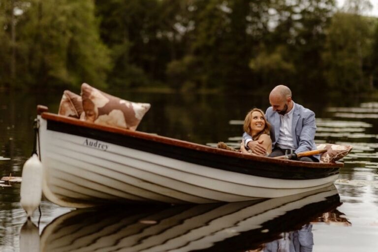 Couple sat in Boat during their Lake District Elopement
