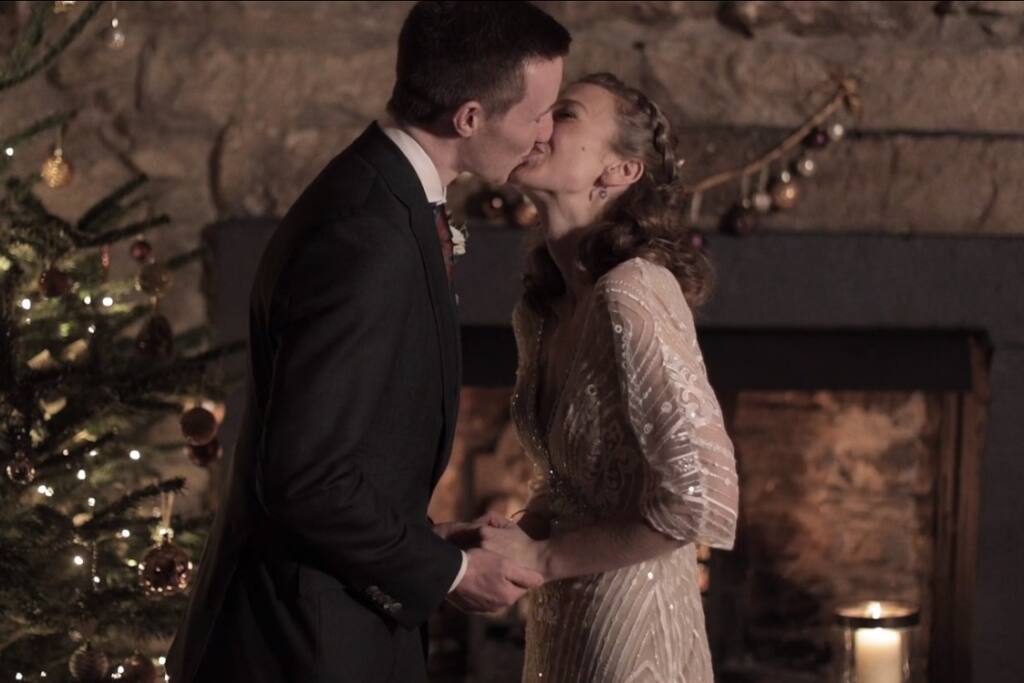Cover image for film of the couple's first kiss during their Christmas elopement in The Lake District