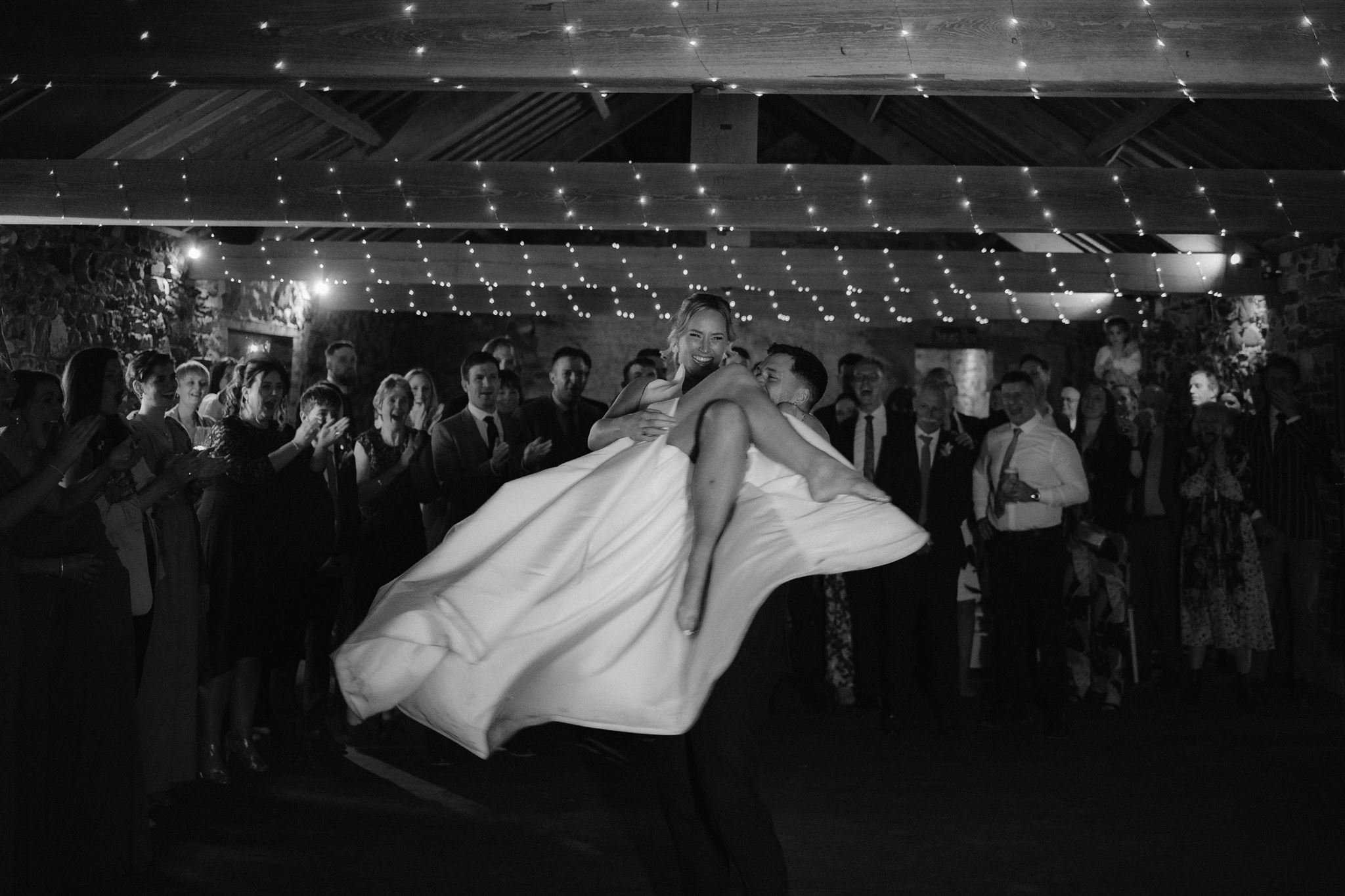Bride and groom dancing at wedding reception.